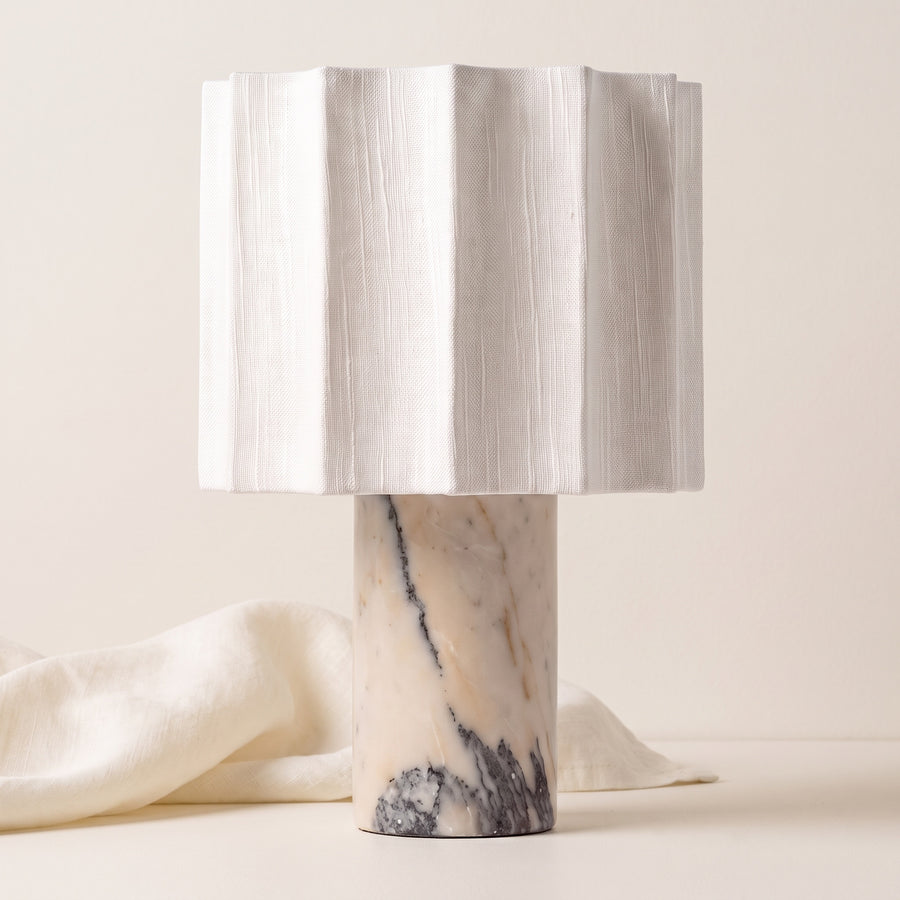 Macara marble and fabric table lamp on an off-white background