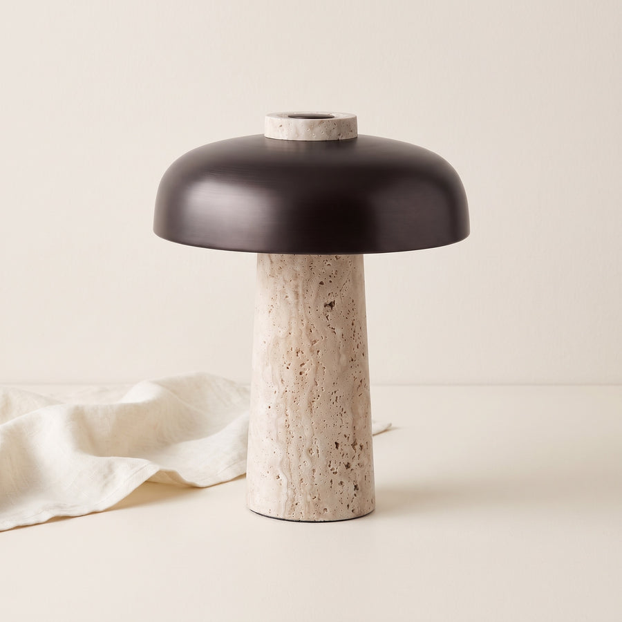 Silex rechargeable travertine table lamp on a cream backdrop with linen cloth