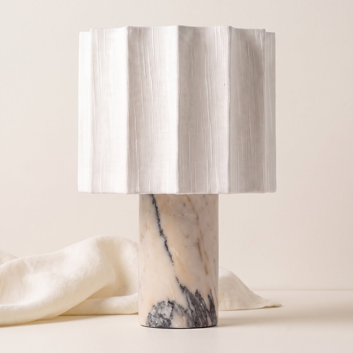 Macara marble and fabric table lamp on an off-white background