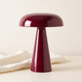 Rubra lacquered table lamp on a cream backdrop with linen cloth